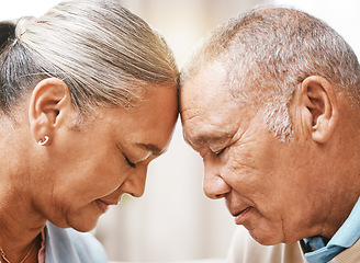 Image showing Face, love and trust with a senior couple in their home, touching heads in support or solidarity together. Relax, peace or romance with a mature man and woman bonding in their house during retirement