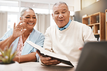 Image showing Wave, laptop and senior couple on video call with book or bible for spiritual studying or reading in home. Greeting, retirement and elderly man and woman waving on online or web chat with computer.