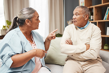 Image showing Senior couple, fight and angry on sofa for marriage problems, conflict and communication. Divorce, argument and frustrated partner of man, woman and people in anger, living room and blame of affair