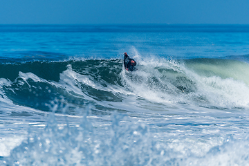 Image showing Bodyboarder surfing ocean wave