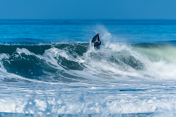 Image showing Bodyboarder surfing ocean wave