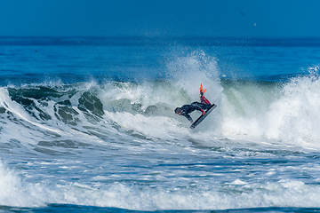 Image showing Bodyboarder surfing ocean wave