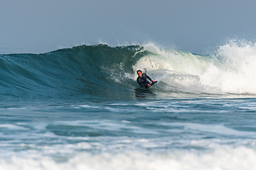 Image showing Bodyboarder surfing ocean wave