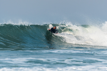 Image showing Bodyboarder surfing ocean wave