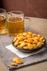 Image showing Tasty lupins and glass of beer