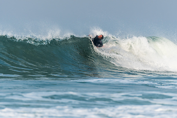 Image showing Bodyboarder surfing ocean wave