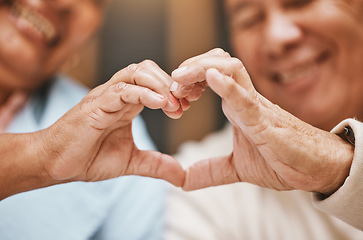 Image showing Love, heart hands or happy old couple with support, trust or hope in a marriage commitment at home. Romance, valentines day or senior man smiles with an elderly woman relaxing on anniversary