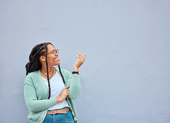 Image showing Mockup, hands and black woman pointing to space for advertising, empty and grey wall background. Hand, gesture and girl relax, happy and smile in studio for product placement, branding and copy space