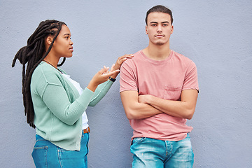 Image showing Interracial couple, wall background and argument in metro with black woman, question and conversation. Young gen z man, partner and conflict in city with relationship, fight and angry arms crossed