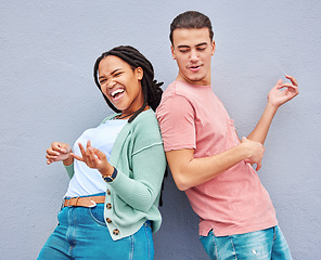 Image showing Dance, happy and playful couple with air guitar for comedy isolated on a grey studio background. Excited, crazy and interracial man and woman playing and dancing with an imaginary instrument