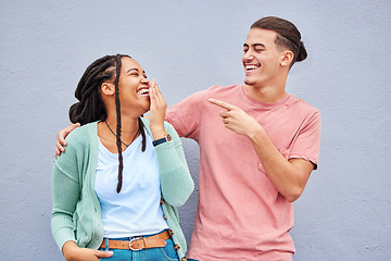 Image showing Joking, laugh and happy with a couple on a gray background, outdoor for fun or freedom together. Laughing, humor or smile with a young man and woman enjoying laughter while bonding against a wall