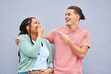Image showing Joking, laughing and happy with a couple on a gray background, outdoor for fun or freedom together. Laughter, humor or smile with a young man and woman enjoying laughter while bonding against a wall