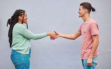 Image showing Friends, handshake or meeting on isolated background in collaboration, teamwork mockup or partnership support. Smile, happy or shaking hands for man, black woman or students in relax fashion clothes