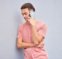 Image showing Man, stress and phone call or isolated wall background on social networking, bad news or sad story. Model, student or depression person on mobile communication technology and anxiety face expression