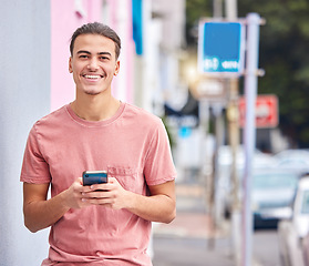 Image showing Man, portrait or phone text on city street, road or urban location on social media app, dating website or internet networking. Smile, happy or student model on mobile communication technology or gps