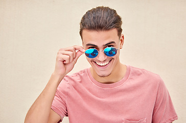 Image showing Man, portrait or fashion sunglasses on isolated background for advertising branding, sales deal or flirty mockup marketing. Smile, happy or student model in summer optician vision for eyes healthcare