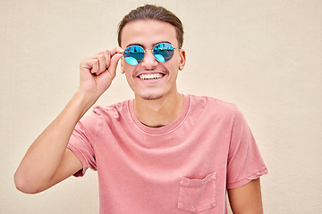 Image showing Man, face and retro fashion sunglasses on isolated background for marketing branding, optometry sales or mock up. Smile, happy and model student and summer optician vision or eyes healthcare wellness