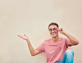 Image showing Mockup, hands and portrait of man pointing to space for advertising, empty and studio wall background. Face, hand gesture by guy relax, happy and smile for product placement, marketing or copy space