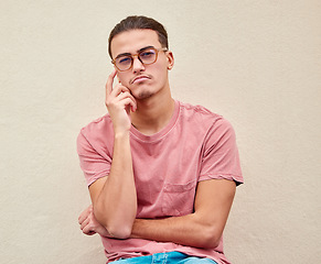 Image showing Thinking, portrait and confused man on mockup in studio for advertising, wall background or space. Face, doubt and male pensive, thoughtful and puzzled on copy space, unsure or emoji gesture isolated