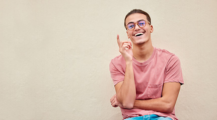 Image showing Portrait, glasses or man pointing up on isolated background for advertising branding, optometry sales deal or mockup marketing. Happy, student or showing hands gesture in fashion eyes vision or news