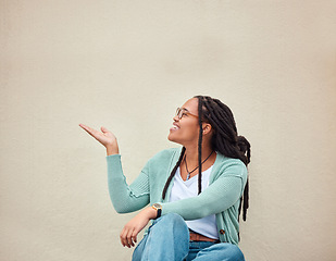 Image showing Happy, black woman and hands pointing to mockup for advertising, space or wall background. Smile, hand gesture and girl excited on product placement, idea or marketing copy space, relax and isolated