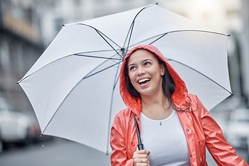 Image showing Outdoor, umbrella and black woman with smile, city and freedom on break, joyful and cheerful. Jamaican, female and lady with cover from rain, town and urban with happiness, comfortable and travel