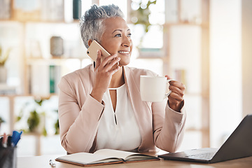 Image showing Senior woman, phone call and coffee by laptop in communication, conversation or discussion at office desk. Elderly female on smartphone smiling with cup talking about business idea plan or networking