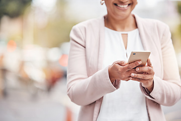 Image showing Woman, hands and phone in city for social media, communication or chatting and texting. Hand of female with smile on smartphone for 5G connection, talking or networking in road of an urban town