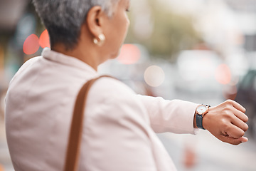 Image showing Watch, senior woman and check time for appointment, deadline and schedule while travelling. Female employee, manager and mature lady with wrist watch, outdoor and commute to work, late and waiting