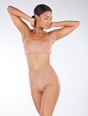 Image showing Body, underwear and beauty black woman isolated on a white background for skincare, cosmetics and aesthetic. Young lingerie model or person in studio mockup for dermatology or hair removal results