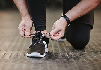 Image showing Fitness, hands and tie shoes in gym to start workout, training or exercise for wellness. Sports, athlete and man tying sneakers or footwear laces to get ready for exercising or running for health.