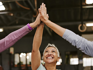 Image showing Fitness, teamwork and high five of senior women in gym celebrating workout goals. Sports targets, laughing face and group of happy friends with hands together for success and exercise achievements.