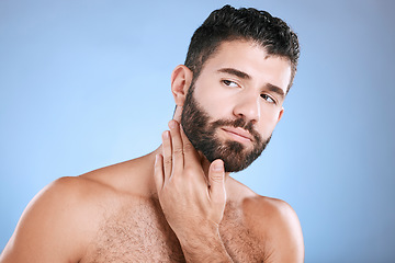 Image showing Idea, skincare and grooming with a man model in studio on a blue background for natural wellness or beauty. Face, beard and skin with a handsome young male thinking about cosmetics or treatment