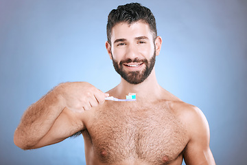 Image showing Teeth, toothbrush and portrait of man in studio for dental wellness, healthy smile and mouth care. Happy face, male model and oral cleaning for fresh breath, gums and dentistry on blue background