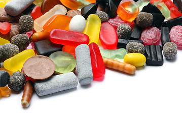 Image showing Photo of colored candies over white background