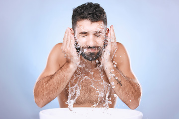 Image showing Face, skin care and man with water splash for clean spa facial for beauty hygiene and dermatology. Aesthetic model person on blue background for health and wellness cosmetics, body and detox cleaning