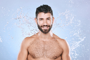 Image showing Man, skin care and face portrait with water splash for clean facial beauty hygiene and dermatology. Happy model person on blue background for health and wellness cosmetics, body and detox cleaning