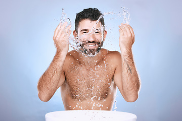 Image showing Water splash, skin care and portrait of man for clean spa facial for beauty hygiene and dermatology. Aesthetic model person washing face on blue background for cosmetics, body and detox cleaning