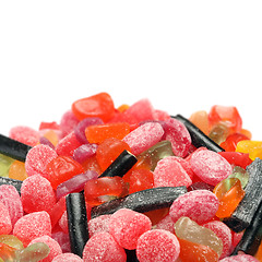 Image showing Photo of colored candies over white background