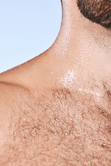 Image showing Water drops, wet torso and closeup man in shower for cleaning, care and wellness on background. Beauty, human body and hairy chest in studio for washing, grooming and hygiene cosmetics for skincare