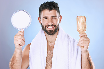 Image showing Portrait, hair and mirror by man in studio for styling, treatment and product advertising on gradient background. Face, haircare and male model relax for brushing, hairstyle or grooming and isolated