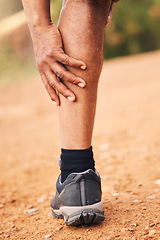 Image showing Leg pain, injury and hands of senior black man after hiking accident outdoors. Sports, training hike or elderly male with fibromyalgia, legs inflammation or arthritis, broken bones or painful muscles