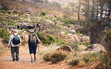 Image showing Hiking, fitness and people walking on mountain for adventure, freedom and wellness in outdoor forest. Travel, healthy lifestyle and senior hikers for exercise, trekking and cardio workout in nature