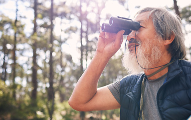 Image showing Binoculars, senior man and hiking in nature looking at view, sightseeing or watching. Binocular, adventure search and elderly male with field glasses, trekking or exploring on vacation outdoors.