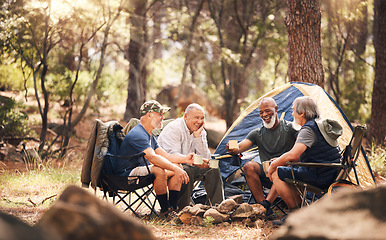 Image showing Man, friends and camping in nature laughing for funny joke, meme or conversation by tent in forest. Group of elderly men relaxing on camp chairs with drink enjoying sunny day together in the woods