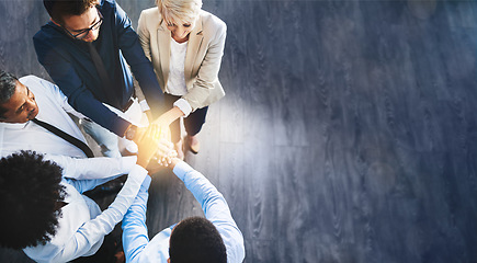 Image showing Business people, team and hands together above on mockup for unity, trust or collaboration at office. Group of corporate workers piling hand for teamwork, agreement or community goals in solidarity