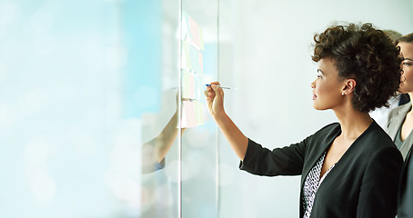 Image showing Business woman, writing and team planning for schedule, strategy or brainstorming sticky notes on mockup. Female in write, post it or teamwork collaboration for corporate growth, idea plan or tasks