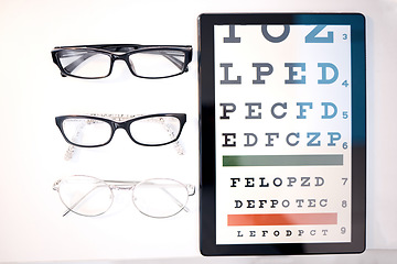 Image showing Optometry, glasses and letter for eye exam on tablet for sight, vision testing and medical care. Optometrist, healthcare and frames, prescription lens and eyeglasses for eyes with test on screen