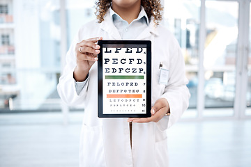 Image showing Hands, optometry chart and tablet screen in hospital for vision examination in clinic. Healthcare, snellen or woman, ophthalmologist or medical doctor holding technology showing letters for eye test.