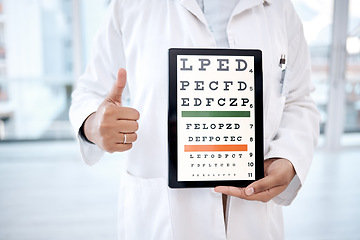 Image showing Hands thumbs up, tablet screen and eye chart in hospital for vision examination in clinic. Healthcare, snellen technology or woman, optometrist or doctor with thumbsup emoji and letters for eyes test